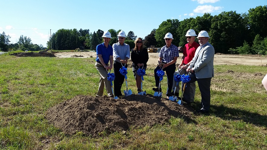 Bank Employees with Construction Hats and Shovels