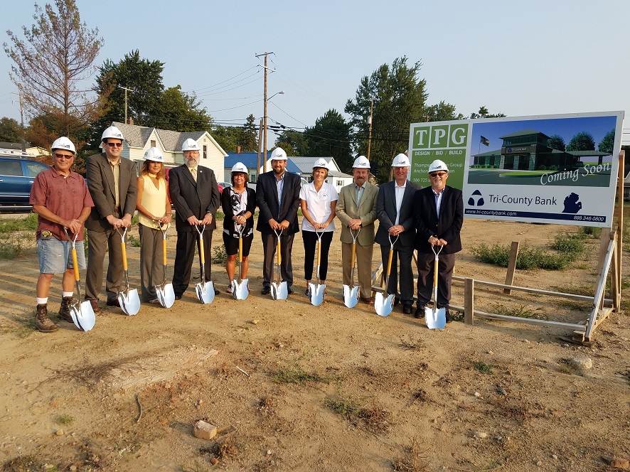 Employees Wearing Construction Hats and Holding Shovels